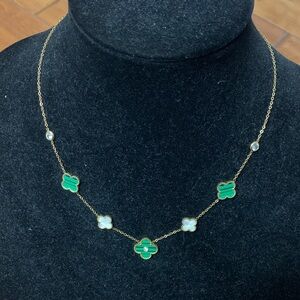 Gold tone green and mother of pearl look clovers necklace - Preowned